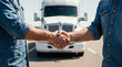 © pantarwat - Two truck drivers shaking hands in front of a semi trailer on the road, symbolizing logistics partnership, transport agreement, teamwork and reliable freight delivery service
