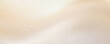 © fila - Abstract soft beige and cream gradient background with subtle splatters and bokeh light effects. vector eps10.