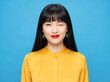 © Aurora Aesthetics - East Asian woman portrait beauty soft blue background twenties ivory yellow blouse relaxed front pose showing clean beauty elegance for skincare cosmetics campaigns diversity identity
