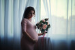 © alexkich - Beautiful pregnant girl with a big belly. Young married pregnant couple. Husband with a pregnant wife. A couple awaiting the birth of a baby.