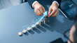 © 2B BOXBLACK - Businessman stacking coins with glowing blue upward trend arrow