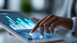 © Nataliya - Close-up of a businessman using a tablet dashboard for finance, marketing and customer data analytics, digital business intelligence concept, multi-domain analytics photography,