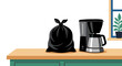 © Yri - Black trash bag next to coffee machine on countertop Concept of indoor waste and kitchen hygiene