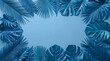 © Omar - Monochromatic blue tropical leaves frame on solid background