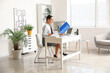 © Pixel-Shot - Young Asian businesswoman with folder working at table in office