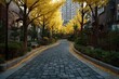 © Rafi - Cobblestone path curves through autumn trees with vibrant golden leaves