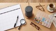 © Zireael - Flat lay of a medication planner with a weekly pill organizer, calendar, glasses, magnifier and smart speaker for healthcare routine planning and elder care