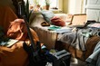 © DragonImages - Wide shot of teenager bedroom showing guitar, amplifier, headphones, notebooks, backpack, and pizza box, suggesting creative student lifestyle. Useful for youth culture or study life marketing