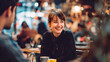 © valeo5 - Young Beautiful Woman Laughing Joyfully While Having Coffee with a Friend in a Cozy Interior Cafe at Night Warm Atmosphere Social Meeting Lifestyle and Happiness in Urban City Restaurant Setting