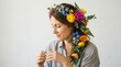 © Kristina - Woman adorned with vibrant floral crown of roses and peonies. Colorful flower headpiece portrait smiling naturally against white background for beauty and nature themes