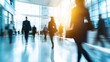 © Harry - A bustling office lobby with people walking quickly in various directions during a busy workday morning rush