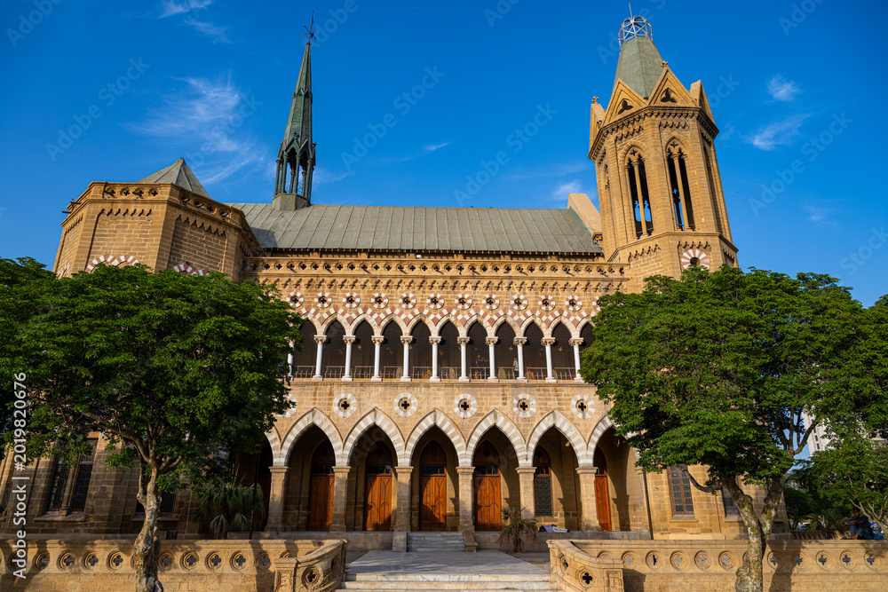 Frere Hall stands in its historic form under a clear sky in Karachi ...