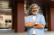 © EFStock - Portrait of cheerful senior man with grey hair and beard looking and smiling at the camera