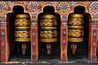 © robertharding - Prayer wheels spinning in Changangkha Lhakhang Temple, surrounded by traditional artwork in Thimphu, Bhutan