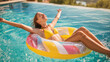 © Nataliia Pyzhova - Happy young woman relaxing on colorful inflatable ring in sunny pool. Summer vacation, freedom and joyful wellness lifestyle