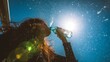 © 锴 张 - Young woman drinking water outdoors under intense summer sunlight with dramatic silhouette and lens flare. Female holding plastic bottle against blue sky in hot weather hydration concept.