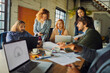 © Geber86 - Young coworkers collaborating in modern loft office