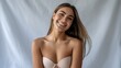 © MDMasud - A beautiful young woman with long brown hair and a joyful smile, wearing a beige strapless top, exuding warmth.