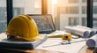 © MopoWe - Yellow hard hat and rolled blueprints sit on a desk in golden hour light. A laptop shows a modern floor plan with sharp focus. Ideal for engineering and real estate development marketing.