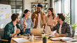 © wiggins - Dynamic diverse group of young business professionals celebrating a milestone success in a bright modern office workspace with natural joyful expressions, showcasing teamwork and achievement.