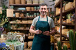 © alvaro - Small business owner man managing plant shop with tablet