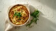 © Yaryna - Golden brown baked potato gratin with fresh parsley garnish. A comforting and delicious potato gratin, baked to perfection and presented in a rustic dish with fresh herbs