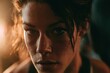 © whitestorm - Intense close-up portrait of a determined woman with sweat glistening on her face after a strenuous workout session.