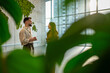 © Migma_Agency - Business people networking with world map background in eco office