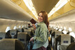 © SISMIZ - Woman holding passport ready for international flight