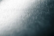 © Vero Dibe - Brushed metal surface creating an abstract texture with light reflections, showing shiny silver tones and a subtle gradient, adding modern or industrial design element