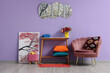 © Pixel-Shot - Interior of stylish living room with pink armchair, table, painting and mirror