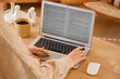 © Pixel-Shot - Female writer editing manuscript on laptop before publishing in office