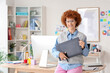 © Pixel-Shot - Redhead female graphic designer with tablet in office