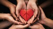 © Bodrul - World mental health day hands supporting a red heart promoting wellbeing compassion