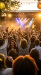 © Zura - Excited Crowd Enjoying Live Music Performance at Outdoor Summer Festival.