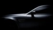 © Ivy - headlight. A sleek grey automobile captured in a dramatic side profile, exuding sophistication and style. mobility guides, transit brochures, designed for mobility and urban transit guides.