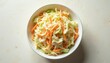 © Vadym - Creamy coleslaw with shredded carrots and cabbage in white bowl. Fresh vegetable salad dressing. Healthy side dish for BBQ or picnic. Light background.