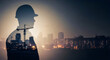 © Tahiea Easmin Riya - Industrial Visionary: A double exposure blends the silhouette of a construction worker in a hard hat with the glittering cityscape and industrial complex at dusk, symbolizing industry and progress.
