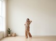 © Rika - Mother Gently Carrying Her Newborn in Wrap in a Bright Minimalist Room