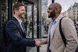© Juan - Businessmen shaking hands outdoors after agreement