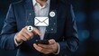 © Han - Businessman using smartphone with virtual email message icon display, digital communication and electronic mail concept for modern business correspondence and customer service
