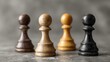 © Khalid - Colorful diversity concept with four pawn figurines symbolizing equality inclusion unity teamwork and multicultural community on grey background minimal creative social representation design