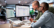© Andrey Popov - HR Manager Uses Digital Software To Track Employee Performance