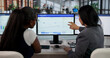 © Andrey Popov - Sales Manager Guides Diverse Team Using CRM Software