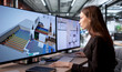 © Andrey Popov - Young Female Engineer Uses Computer Software