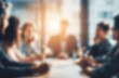 © Generative AI - Diverse business professionals collaborating in a bright, modern conference room during a meeting