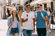 © Juan - Teenage group eating popsicles while exploring downtown area