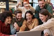 © Juan - Young professionals celebrating success while working together