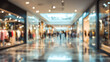 © Subin - A bustling shopping mall scene featuring a vibrant atmosphere with blurred figures and bright storefronts.