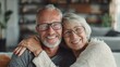 © Ammad - A happy elderly husband and smiling mature wife embrace lovingly, showcasing the joyful retirement of a married senior couple together
